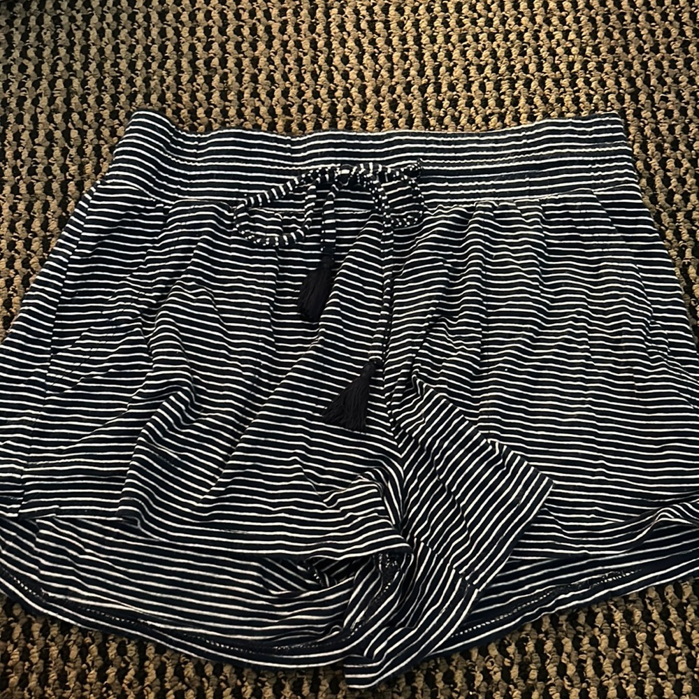 Stars above navy striped pajama shorts